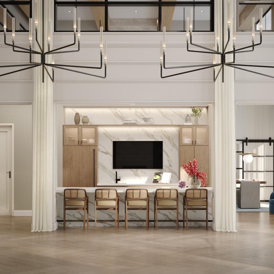 a kitchen with a tv, bar and chairs