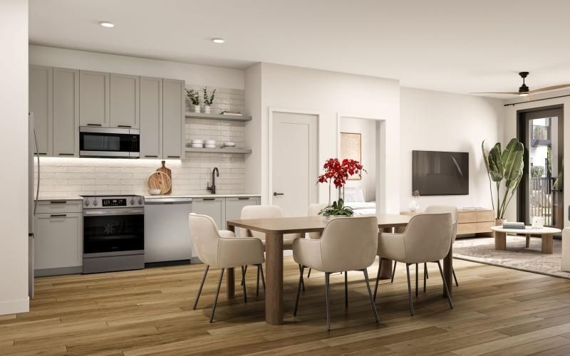 a kitchen with a dining table and chairs