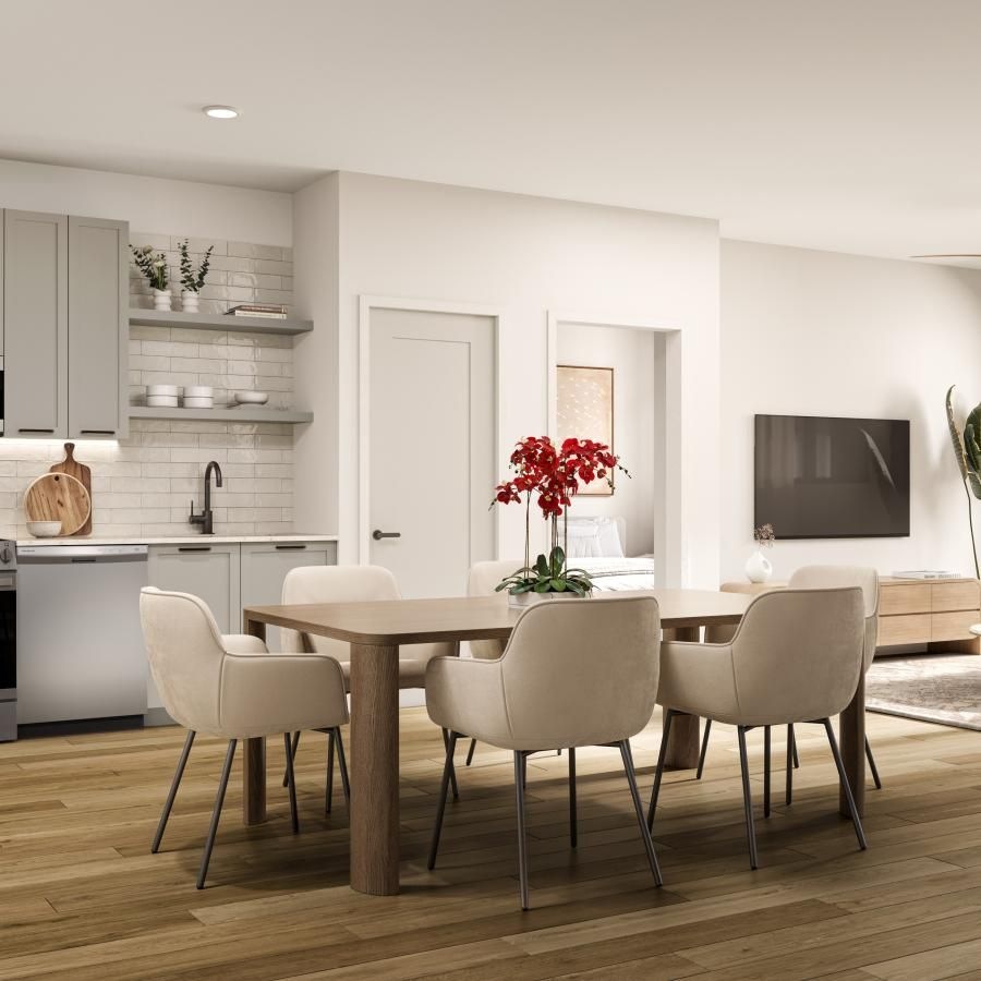 a kitchen with a table and chairs